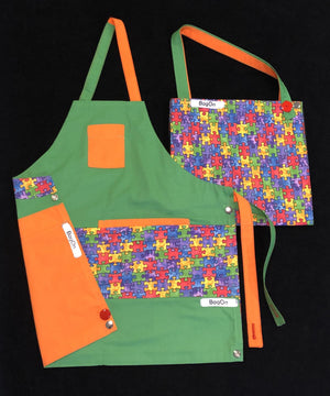 Green Apron with Puzzle Pieces Fashion Fabric and Orange Accents