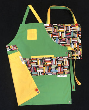 Green Apron with Yellow Accent and Books Fashion Fabric